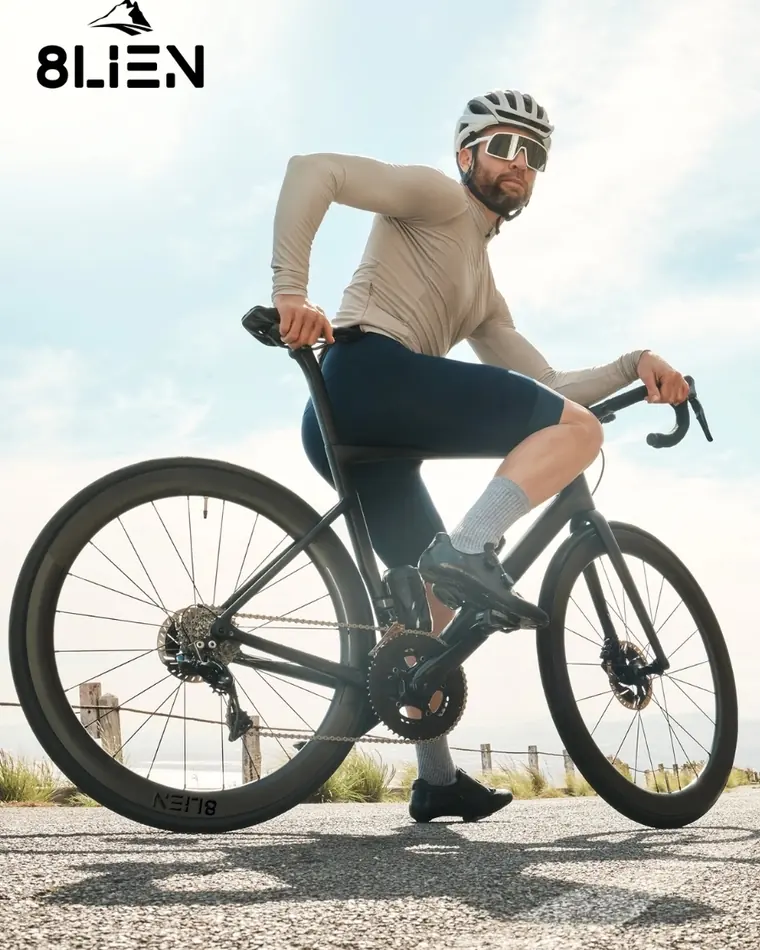 Cyclist on a road bike with deep carbon wheels