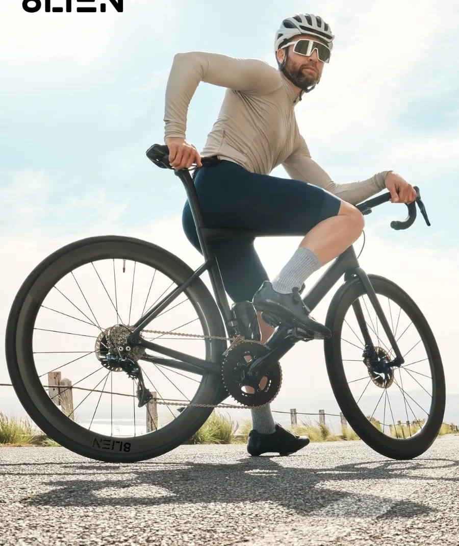 Cyclist riding a road bike on a coastal road